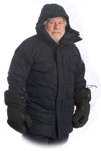 Man wearing Wiggy's heavily insulated olive colored Antarctic Parka shown from the waist up against a white background