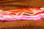 Hareline Two Toned Rabbit Strips 1/8" (Top- Hot Orange Tipped White; Bottom- Hot Pink Tipped White)