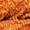 Hareline Speckled Crystal Chenille (Red/Orange)