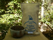 Peaberry 100% JBM coffee one-pounder with sample Peaberry JBM beans displayed.