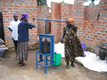 Local women use manual hand press to make shea butter in Lira, northern Uganda.  Our manual pressing like this helps preserve the natural properties and freshness of the shea butter.
