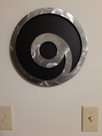 12inch Black powder coated 16 gauge steel and will not rust . Great for indoor or outdoor decor.