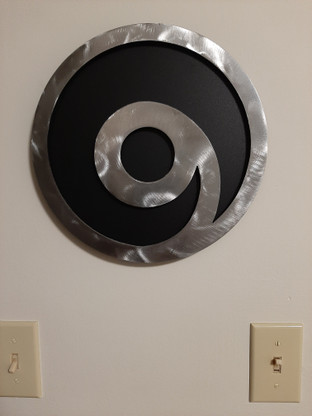 12inch Black powder coated 16 gauge steel and will not rust . Great for indoor or outdoor decor.