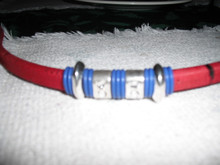 Red cork covered leather , blue (darker than photo) and silver accents. Antique silver magnetic clasp. Will cut to size up to 8 inches. Please order and send email to jean@graysondesignstudio.com