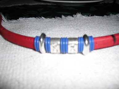 Red cork covered leather , blue (darker than photo) and silver accents. Antique silver magnetic clasp. Will cut to size up to 8 inches. Please order and send email to jean@graysondesignstudio.com