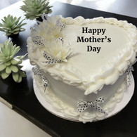 A white two layer cake with Happy Mother's Day in frosting on the top.