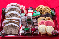 Gourmet Basket of Delights!   Sure to please any office with treats for the entire day!  Start off with our freshly baked banana bread, a full pound of chocolate pecan fudge, three designed petite cookies, one dozen of our freshly baked gourmet cookies and six Christmas designed cake balls to finish.