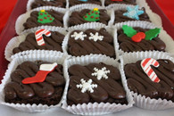 One dozen Christmas Frosted Brownies.  Our signature chocolate iced brownie with a great Christmas decoration to top it off.  