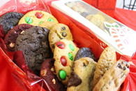 One dozen individually wrapped gourmet cookies in a festive seasonal box.  A great way to send warm wishes!