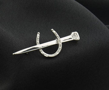 Sterling silver horseshoe and nail stock pin.