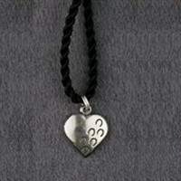 Sterling silver "Hoof Prints on Your Heart" charm pendant.