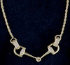 14k gold bit necklace with .18ctw diamonds. Moveable bit ends. 17" length.