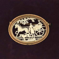 Oval Celluloid Brooch with Carriage, Horse and Hound.