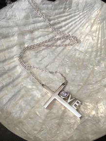 Love Cross™ NORTH STAR in solid sterling silver on an 18" silver chain. 

Pendant Size: 1-1/8" x 3/4" 
Made in USA.