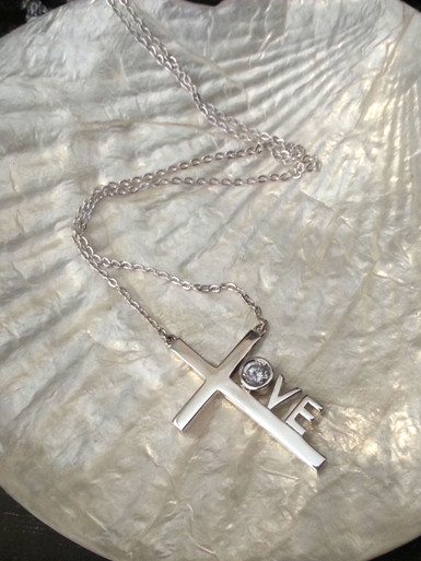 Love Cross™ NORTH STAR in solid sterling silver on an 18" silver chain. 

Pendant Size: 1-1/8" x 3/4" 
Made in USA.