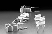 100056  Circuit Board Mount Fuse Clip with Ear Stops for 5mm Diameter Fuses, Spring Brass with Tin Plating.