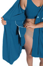 The Recovery Brobe in Blue is designed for women undergoing any breast surgery such as mastectomy, reconstruction, breast augmentation or reduction. Inside the robe are pockets on either side to hold post-operative fluid drains. The front velcro closure bra also has pockets built inside to hold ice packs and/or a prosthetic breast.