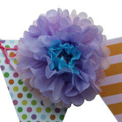 These flower pom poms look amazing on bunting.