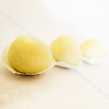 Spongy white rasgulla balls in light sugar syrup