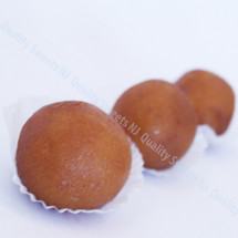 Golden brown gulab jamun soaked in cardamom syrup