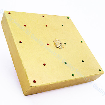 Small gold gift box with embossed Lord Ganesh figure