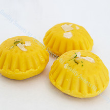 Kesar peda yellow milk sweets with saffron and pistachios