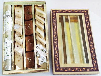 Closed golden gift box with textured lid