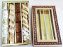 Closed golden gift box with textured lid