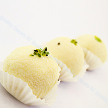 Pista sandesh topped with sliced pistachios