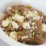 Moong dal halwa made with ghee and topped with slivered almonds