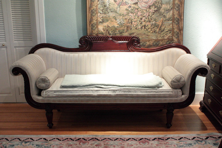 sofa against a wall in a living room