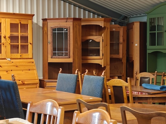 various wooden antique furniture in a store