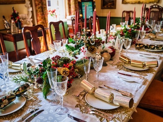 a Christmas table setting with vintage furniture