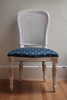 French Cane Chair with white frame and blue and gold fabric