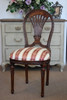 Horseshoe chair in striped white, red, gold fabric