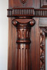Ionic column carved into the fireplace mantel