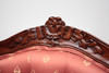 Rosette carving on top of armchair