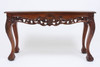 Solid wood table construction with hand carved details