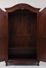 Spacious armoire interior with clothes hanging rod and shelf