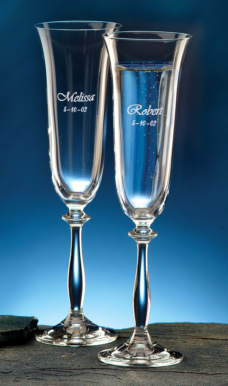 Custom 7oz champagne flutes imported from Europe and personalized with first names and wedding date