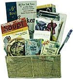 Gift basket arrangement filled with teas, soup, crackers, novelty book, and note paper 