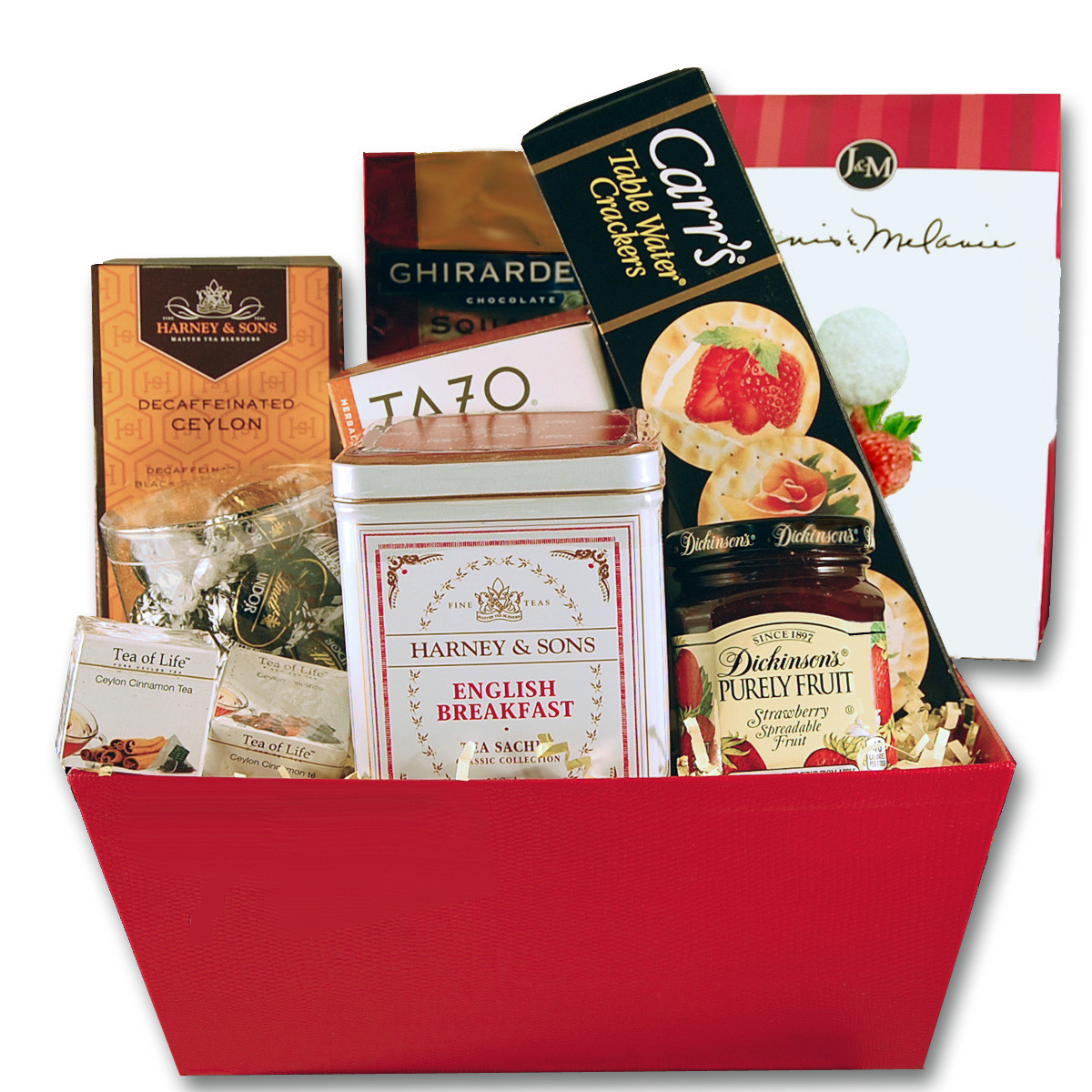 Gift basket arrangement filled with teas, dessert wafers, confection caramels, dried fruit, and honey
