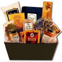 Gift basket featuring an assortment of chocolates, sweet and salty snacks, and dried fruit