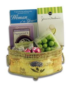 Gift basket arrangement filled with chocolate-covered confections, teas, and mints