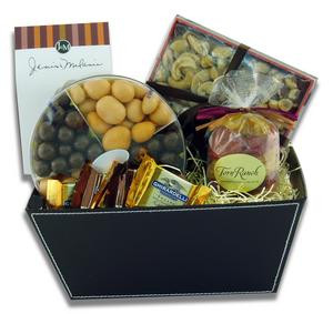Gift basket arrangement filled with sweet and salty edibles, caramels, chocolate covered fruit, cookies, and nuts