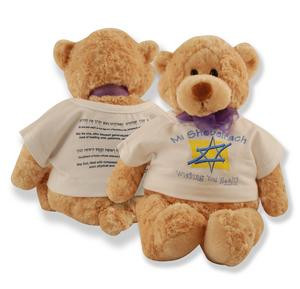Plush bear wearing a universal prayer displayed on a shirt for those of the Jewish faith to pray for cure from illness