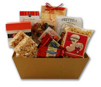 Gift basket arrangement filled with a variety of sweet and salty snacks