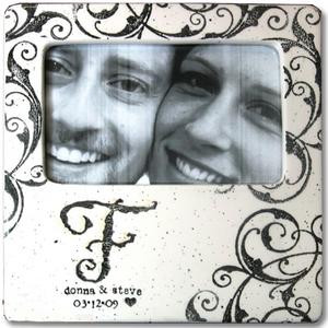 Hand painted ceramic photo frame personalized with single initials, first names, and dates