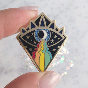 Cosmic Eye Enamel Pin - Rainbow Aura Third Eye - Wildflower + Co.
Show off your spiritual AND colorful side with this cosmic eye enamel pin. We updated the classic evil eye to hold the secrets of the night sky & radiate a rainbow aura. Glitter accent adds a little magic!
