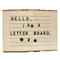 The letter board displayed with letters in place, demonstrating its use for customizable messages. The contrast between the clean lettering and natural wood surface offers a perfect blend of modern and rustic design.